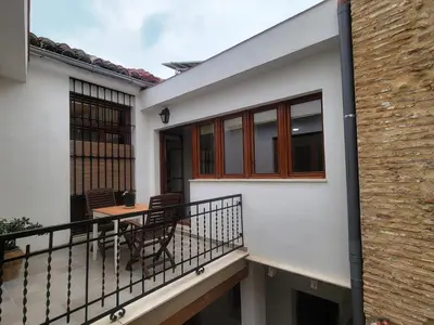 a balcony of a house with a table and chairs at Casa ALFANG in Torrent