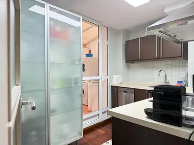 a kitchen with a sliding glass door in a kitchen at Centro Histórico Valencia 2 Hab in Valencia
