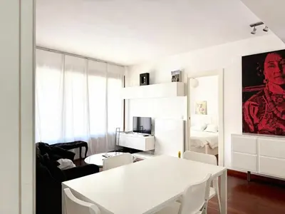 a white dining room with a white table and chairs at Centro Histórico Valencia 2 Hab in Valencia