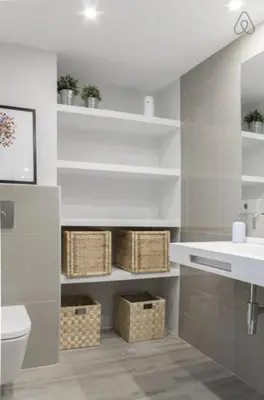 a white bathroom with a sink and a toilet at Austria 4 in Valencia