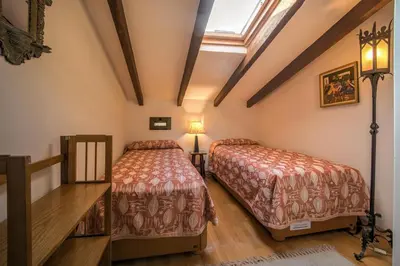 a bedroom with two beds and a skylight at Beds & Breaks Verdi in Valencia