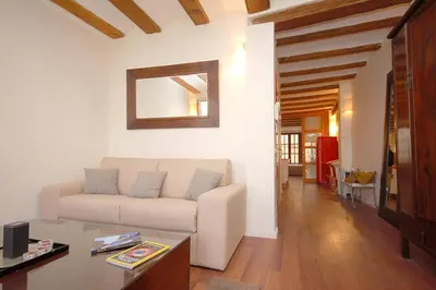 a living room with a couch and a table at Beds & Breaks Ravel I in Valencia