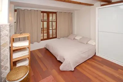 a small bedroom with a bed and a window at Beds & Breaks Ravel I in Valencia