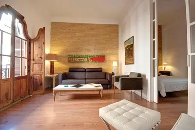a bedroom with a bed and a book shelf at Beds & Breaks Strauss in Valencia