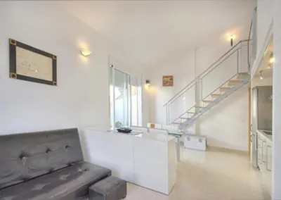 a kitchen with a glass counter and a staircase at Beds & Breaks Pergolesi in Valencia
