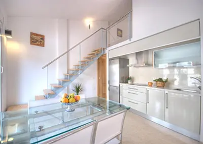 a kitchen with a sink and a stainless steel refrigerator at Beds & Breaks Pergolesi in Valencia