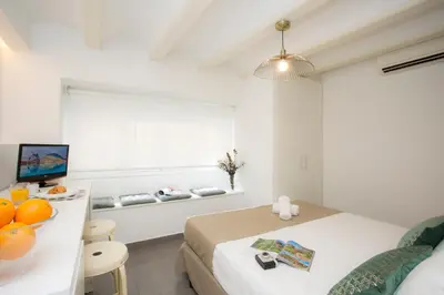 a white room with a bed and a window at SingularStays Botanico 29 Rooms in Valencia
