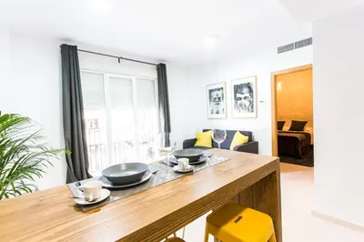 a kitchen with two bowls on a wooden table at Total Valencia Old City Luxury in Valencia