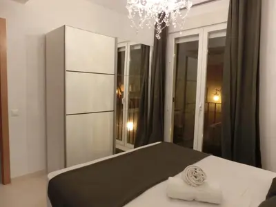 a bedroom with a bed and a large mirror at Total Valencia Old City Luxury in Valencia