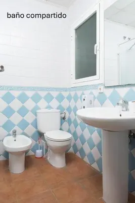 a bathroom with a toilet and a sink at NWT Central Station Valencia in Valencia