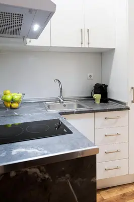 a kitchen with a sink and a counter top at Down Town in Valencia