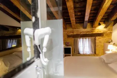 a room with a bed and a window at Host & Home in Valencia