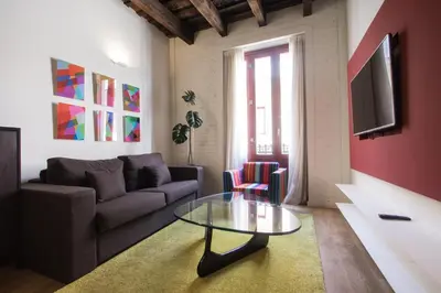 a living room with a couch and a glass table at Valencia Luxury - Boutique Redonda in Valencia