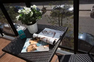 a table with a magazine and a picture on it at SingularStays Artes in Valencia