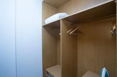 a walkin closet with wooden walls and a woodenventory at SingularStays Artes in Valencia