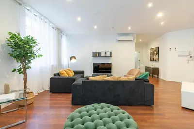 a living room with a couch and a table at Travel Habitat Teatro Principal in Valencia