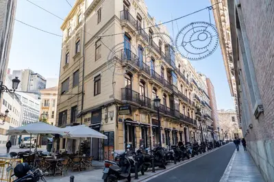 a row of motorcycles parked in front of a building at Travel Habitat Teatro Principal in Valencia