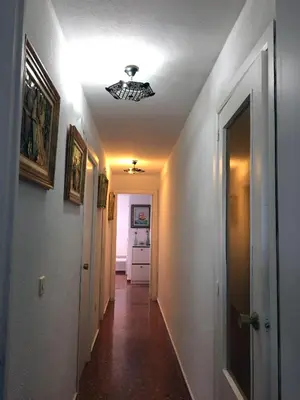 a hallway with a ceiling fan in a room at Apartamento PuigVal in El Puig