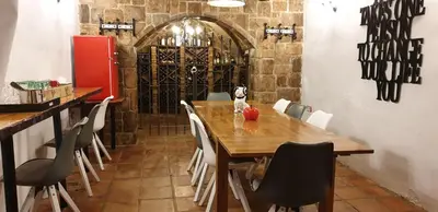 a bedroom with a bed with a lamp and a desk at Hotel Iris La Eliana in La Eliana