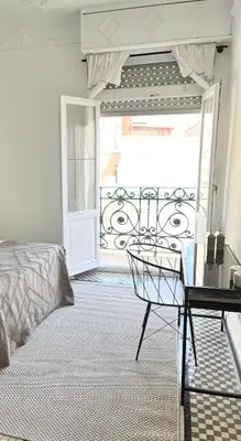 a bedroom with a bed and a glass table at Victoria Site-Luxury Center in Valencia