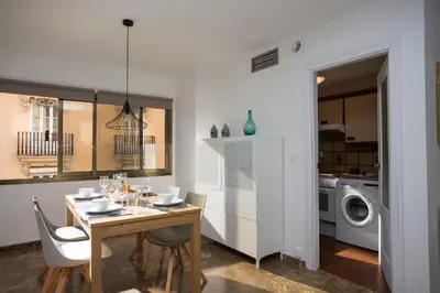 a kitchen and dining room with a table and chairs at Xativa Terrace II in Valencia