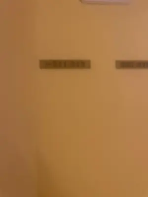 two signs on a wall in a room at La Posá in Villar del Arzobispo
