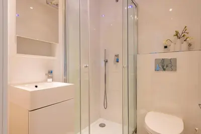a bathroom with a shower and a toilet and a sink at Salamar Saler Golf in El Saler