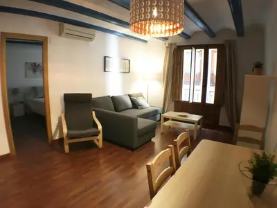 a living room with a couch and a table at Living Valencia Peydro in Valencia