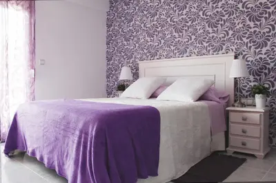 a bedroom with a purple bed with a purple blanket at Sweet Caroline Apartment in Valencia