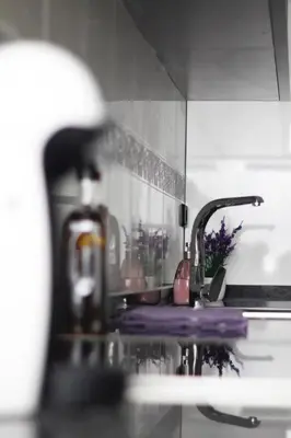 a kitchen counter with a sink and a faucet at Sweet Caroline Apartment in Valencia