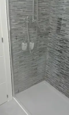 a shower with a glass door in a bathroom at Sweet Caroline Apartment in Valencia