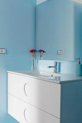 a bathroom counter with a sink and a mirror at Sweet Caroline Apartment in Valencia