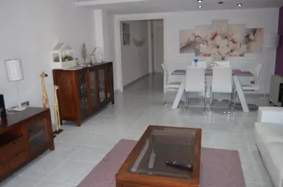 a living room with a couch and a table at Sweet Caroline Apartment in Valencia