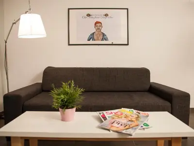 a living room with a couch and a table at Flats Friends Soho Suites in Valencia