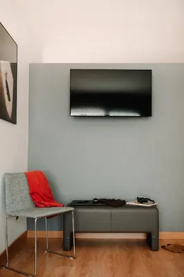 a living room with a couch and a chair at Parker The Urban Flats in Valencia