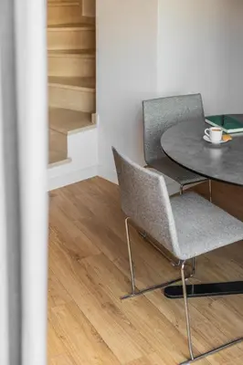 a table and two chairs and a table and stairs at Parker The Urban Flats in Valencia