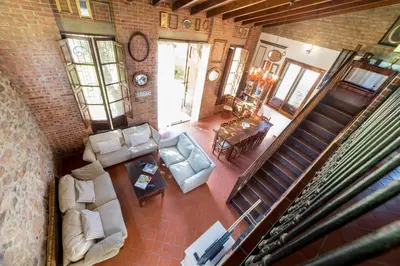 an overhead view of a living room with furniture and stairs at Villa Rotonda in Alquerías del Niño Perdido