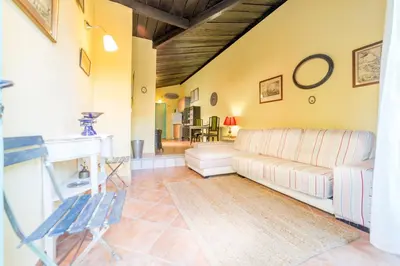 a living room with a couch and a table at Villa Lupita in Alquerías del Niño Perdido