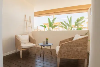 a room with two chairs and a table and a window at Meraki Beach Hotel - Only Adults in Playa Pobla de Farnals