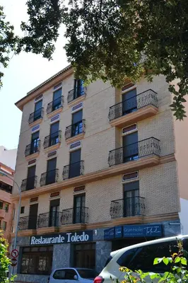 a tall building with balconies on the side of it at Gran Hotel Toledo in Onda