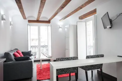 a living room with a white table and chairs at Apartment Boutique in Valencia