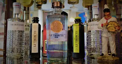 a group of bottles of alcohol on a table at Hotel L'Escala in Cullera