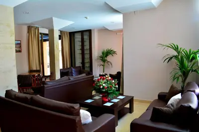 a living room with couches and a coffee table at Hotel L'Escala in Cullera