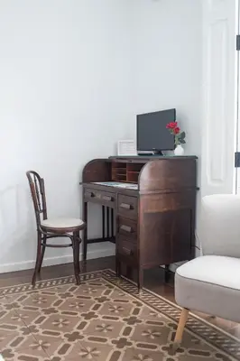 an office with a desk with a computer and a chair at ABCyou Bed&Breakfast in Valencia