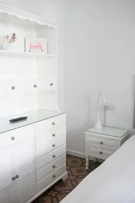 a white bedroom with a white dresser and a bed at ABCyou Bed&Breakfast in Valencia