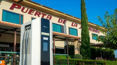 a parking meter in front of a building at Hotel Puerta de la Serrania in Lliria