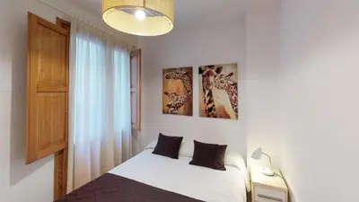 a white living room with a white table and chairs at Edificio Palomar - PalomarGroup in Valencia