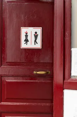 a red door with a sign on it at Home Youth Hostel by Feetup Hostels in Valencia