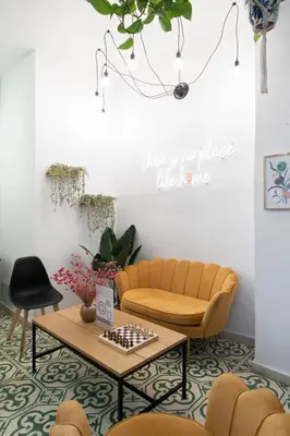 a living room with a couch and a table at Home Youth Hostel by Feetup Hostels in Valencia