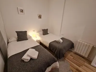a room with two beds with towels on them at Alojamientos Segóbriga Rural (Artesa) in Segorbe